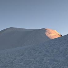 Sunrise hitting the true summit