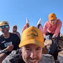 Group shot. Tim N7KOM has goat horns and ears on his hat.